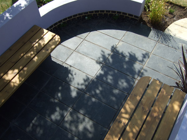 Wooden benches with black limestone